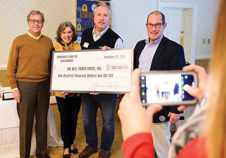 Josh Bergeron / Salisbury Post - From left, Dyke Messinger, Margaret Kluttz, Glenn Taylor and Jason Walser pose for a picture Friday after the Kiwanis Club of Salisbury presented a check to the Bell Tower Green Park project. Messinger and Kluttz are on the board of the Bell Tower Green Park. Wasler is executive director of the Blanche and Julian Robertson Foundation.